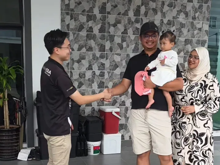 David Lau congratulating homeowners after a successful property handover