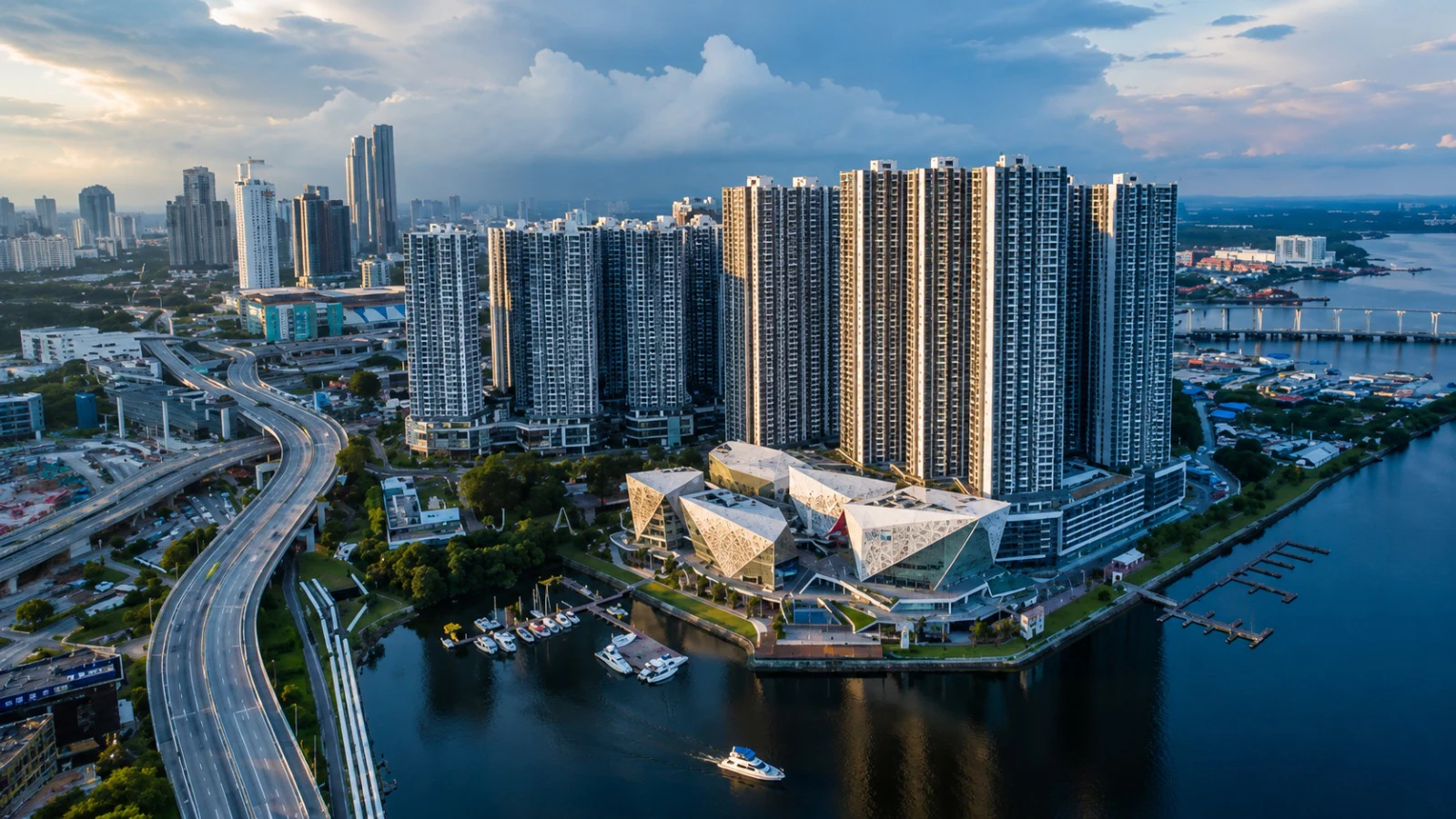 Aerial view of Johor Bahru's waterfront skyline and city infrastructure